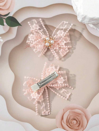 Peach embellished net hair bows