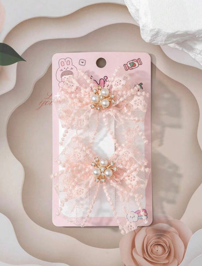 Peach embellished net hair bows